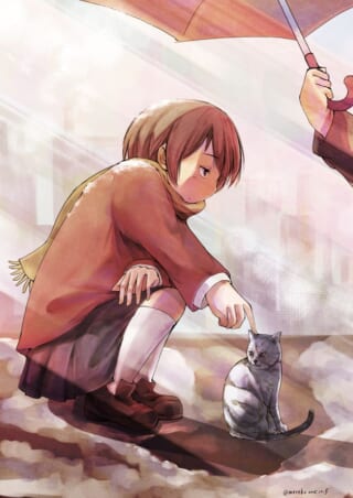 女の子が猫を指差している。