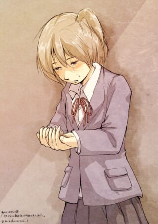 泣いている制服の少女。