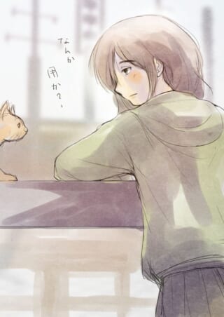 少女が猫に話しかけている。