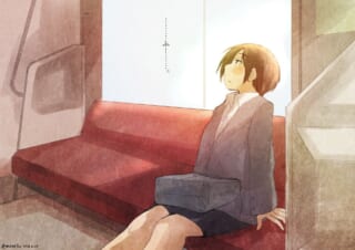 電車内で疲れた女性が座る。