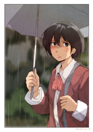 少女が雨の中で傘をさす。