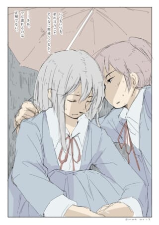 傘を差す二人の女子学生