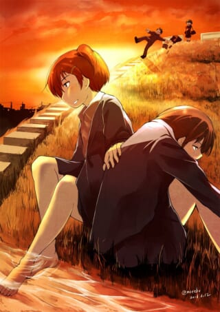 夕焼けの丘に座る学生たち