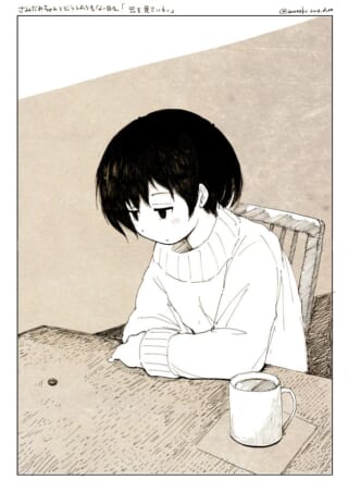 女の子がテーブルを見つめる。