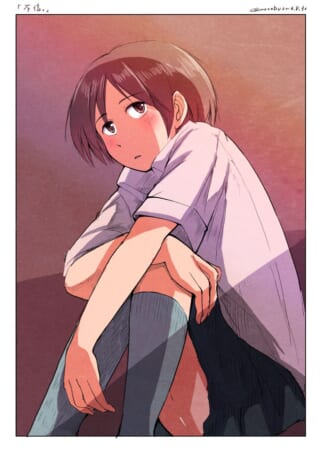 ショートヘアの少女が座っている。