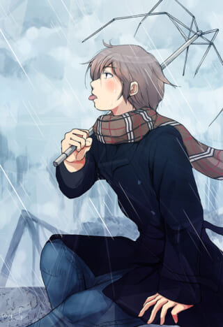 壊れた傘と雨の日の少年