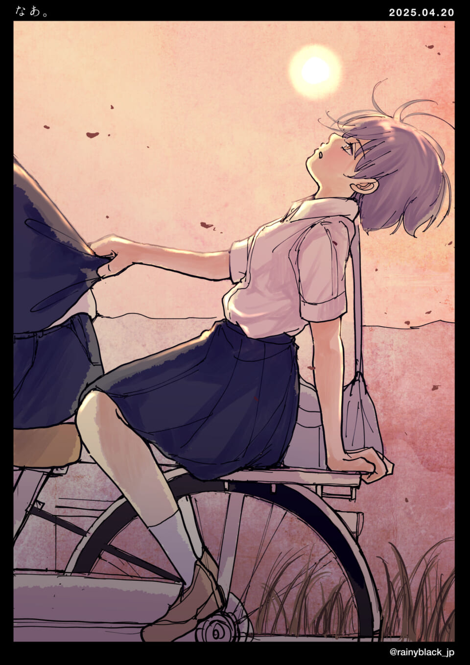自転車に乗る少女の夕暮れ風景