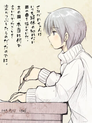 女の子が机で絵を描いている。