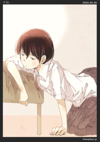 机にうつ伏せする少女
