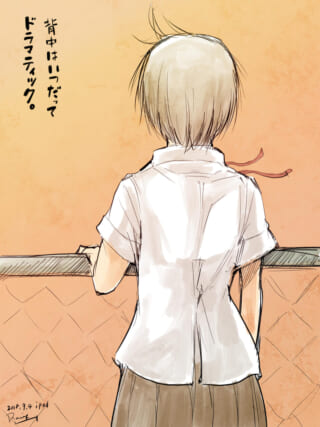 後ろ姿の学生と夕焼け