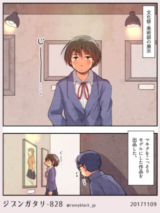 文化祭で作品を見つめる女子学生。